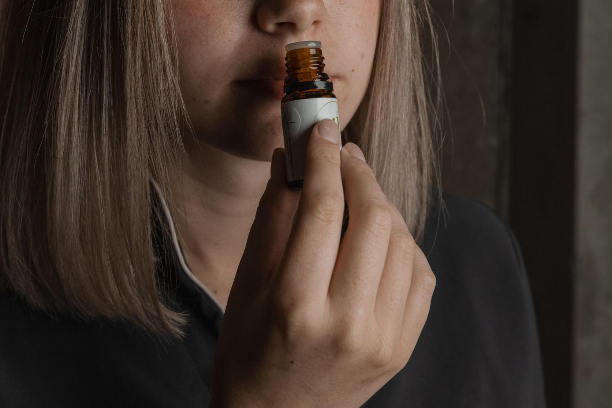 Peppers Silo Hotel Launceston Exterior photo A woman smelling a bottle of essential oil